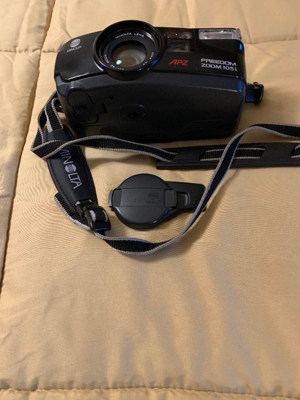 Black Freedom Zoom 105 I Minolta APZ camera with strap, lens cover -pre-owned